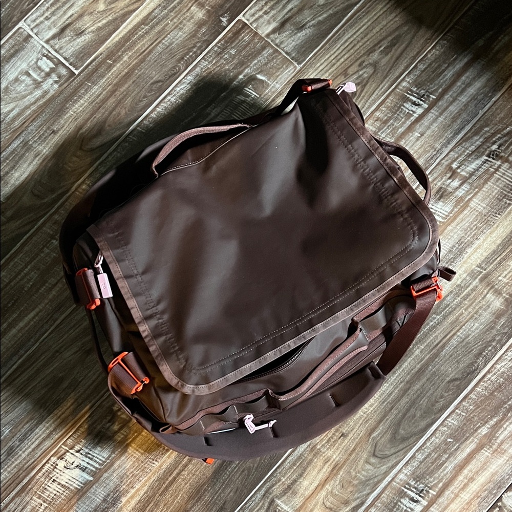 Baboon to the Moon brown/mauve 40L small go Bag with Orange & red Accents